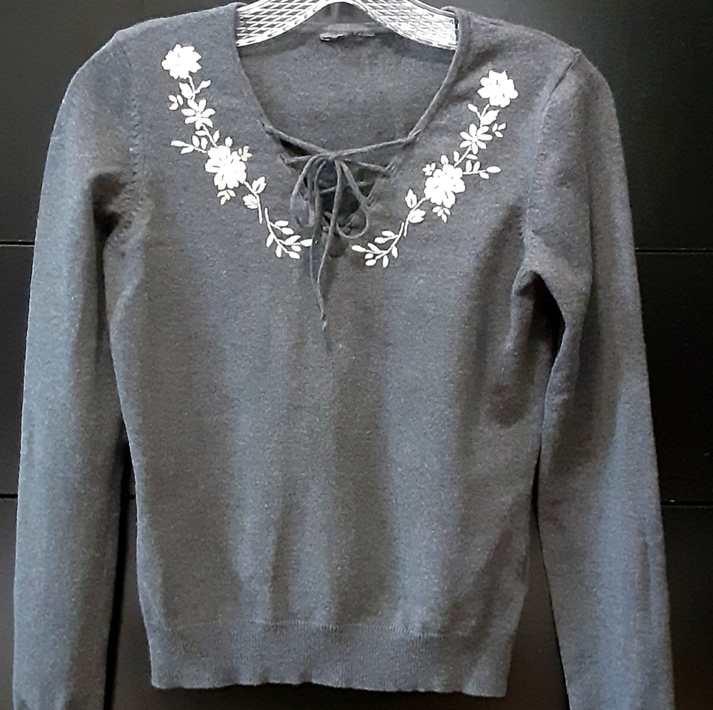 Embroidered sweater with lace-up detail